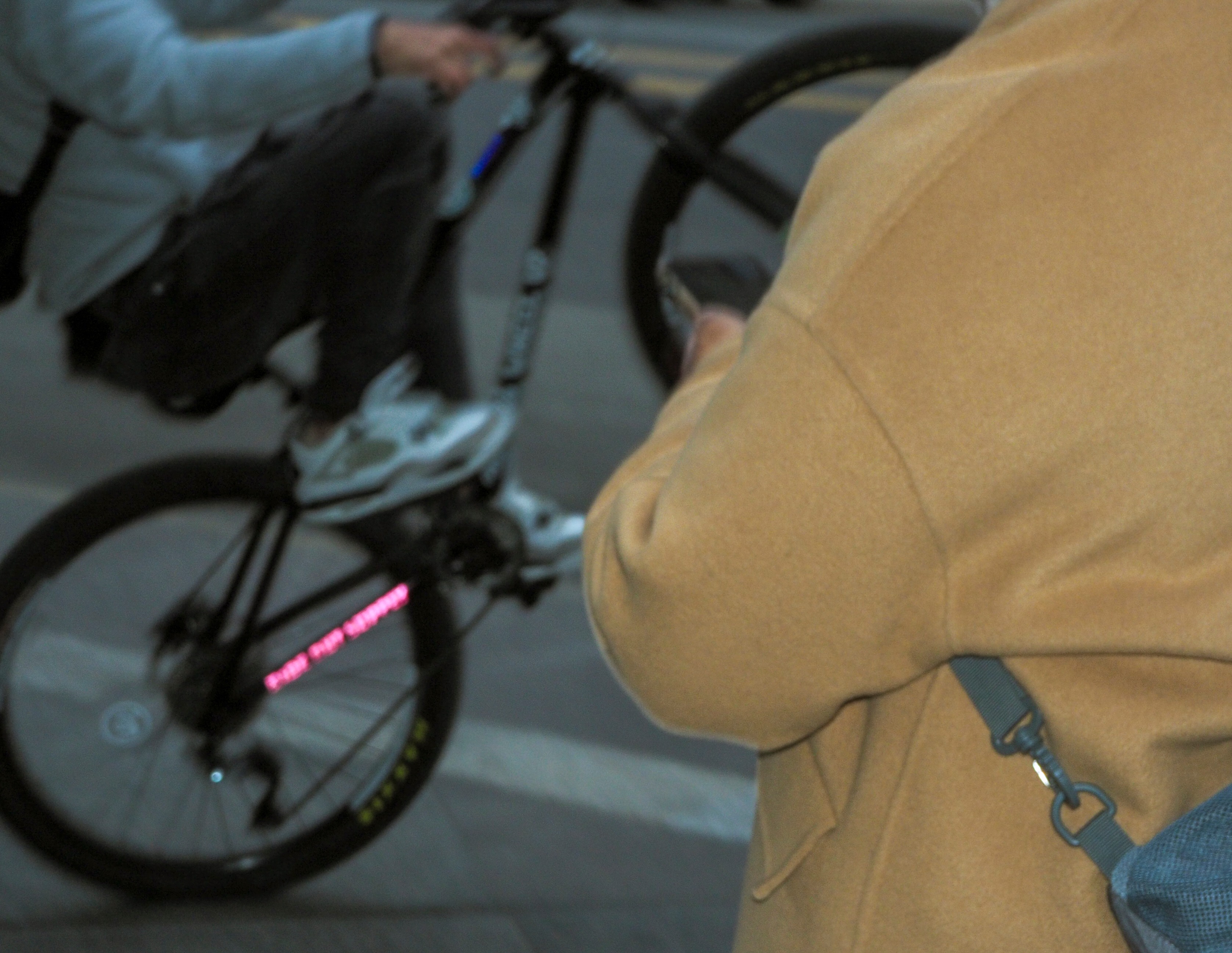 Close-up artistic shot of person with bike wheel