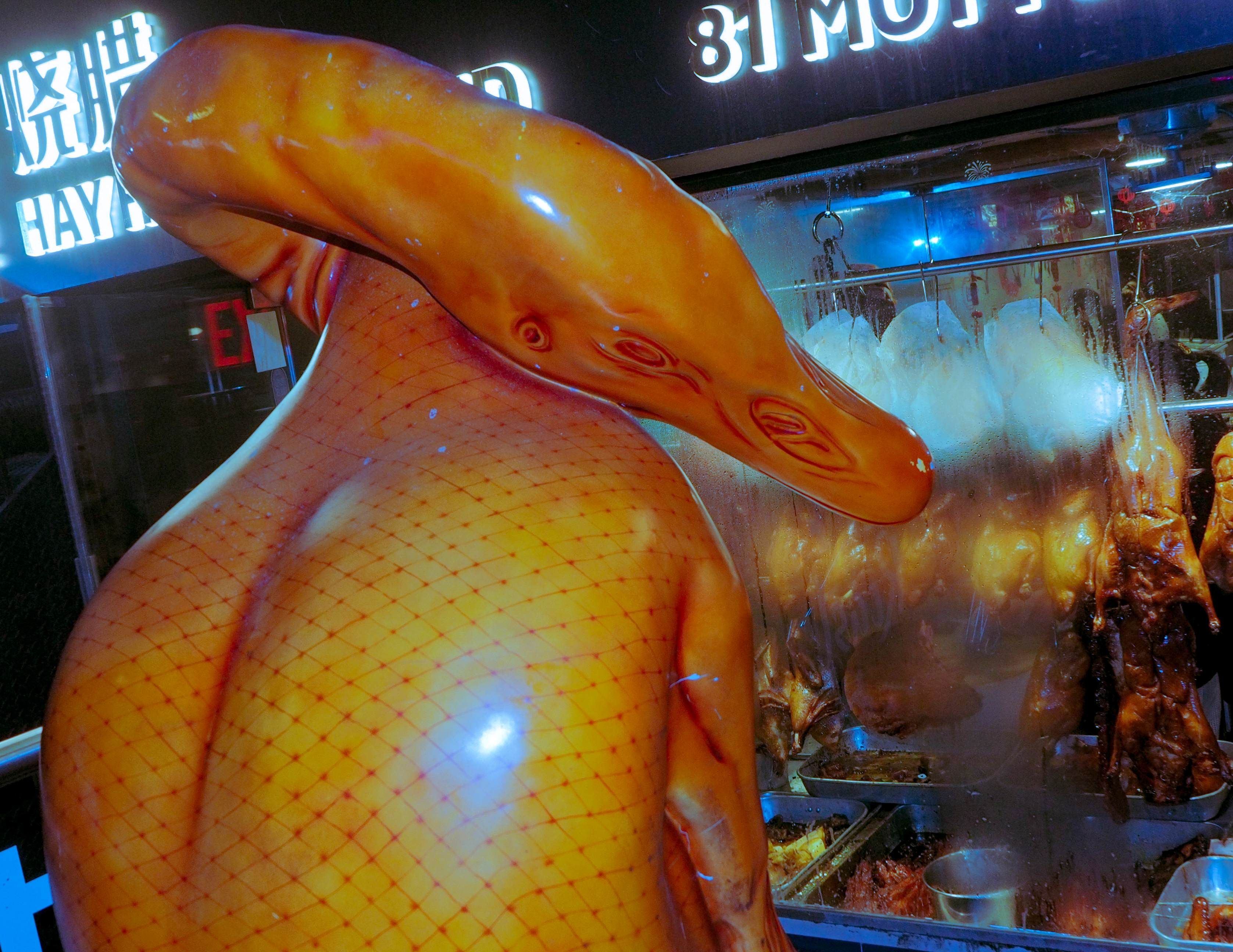 Large inflatable chicken decoration outside restaurant