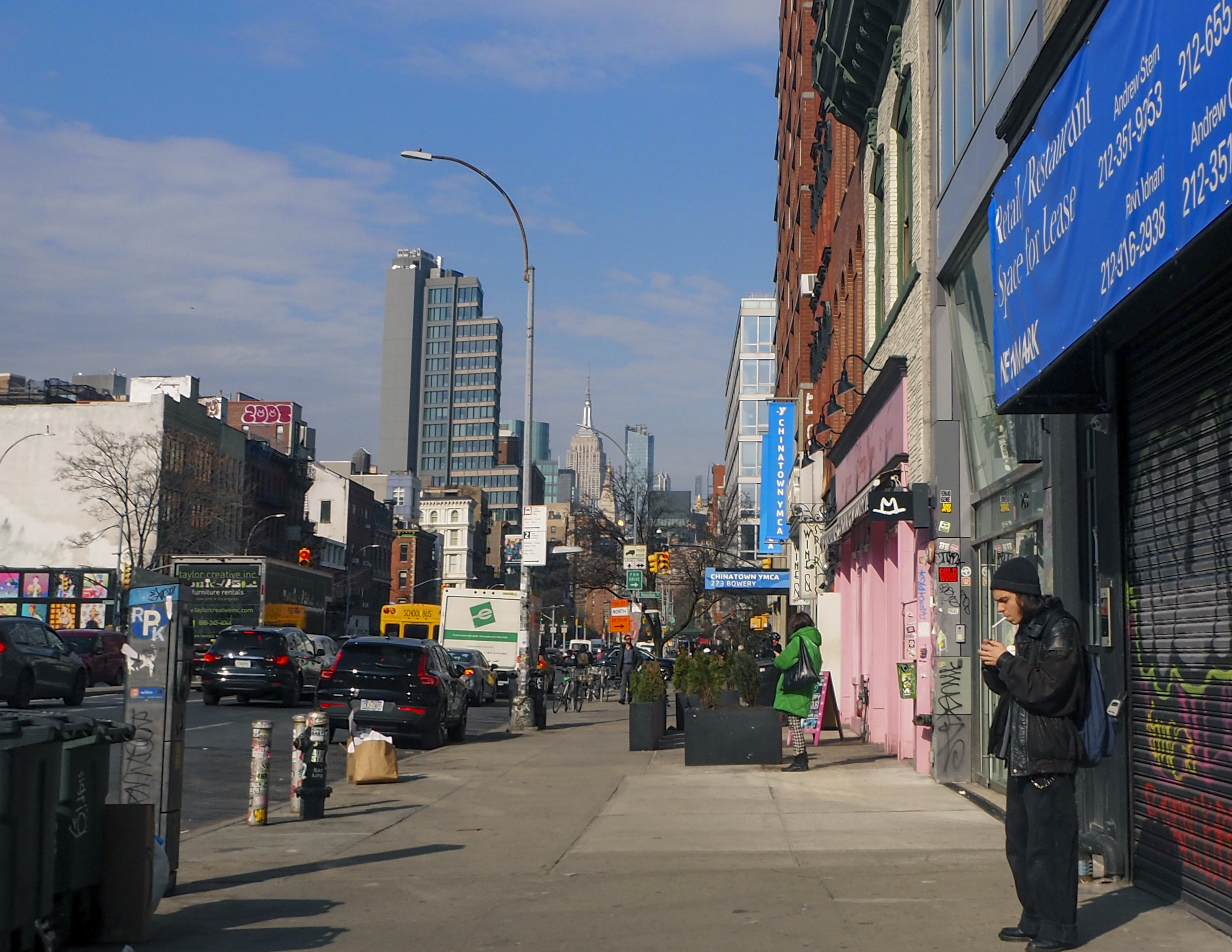 NYC street with Empire State Building in background