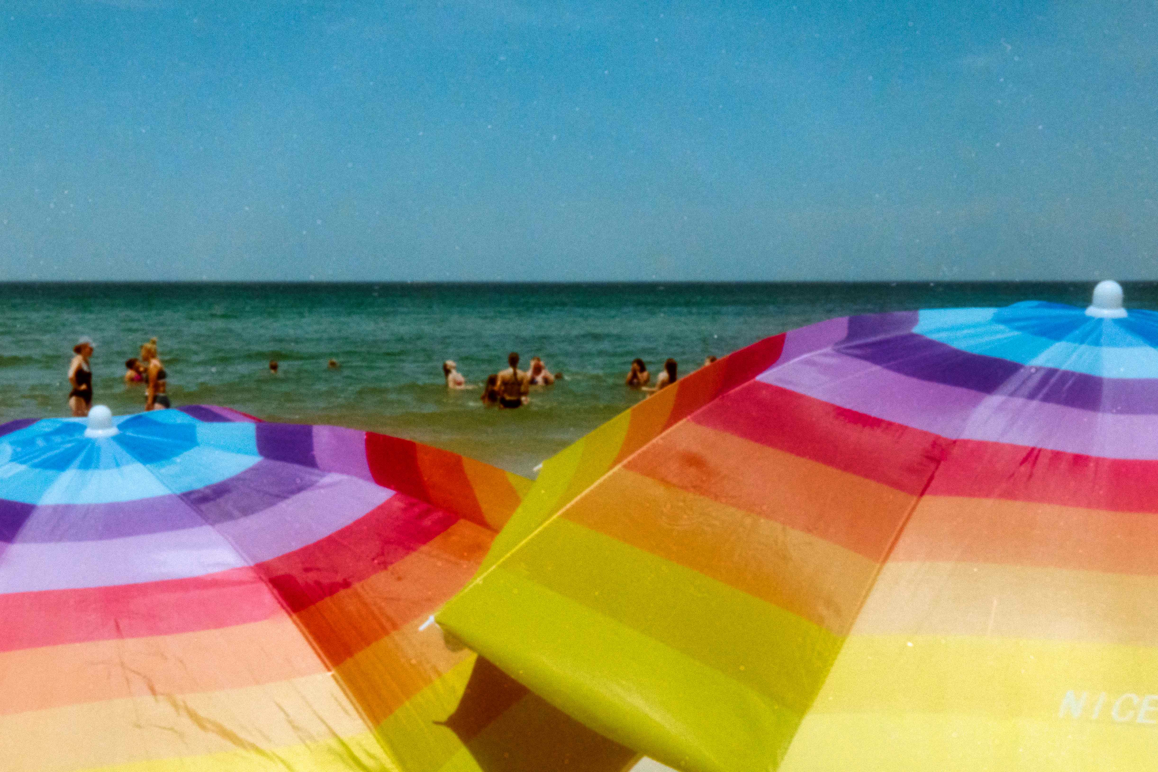 Colorful beach umbrellas and ocean